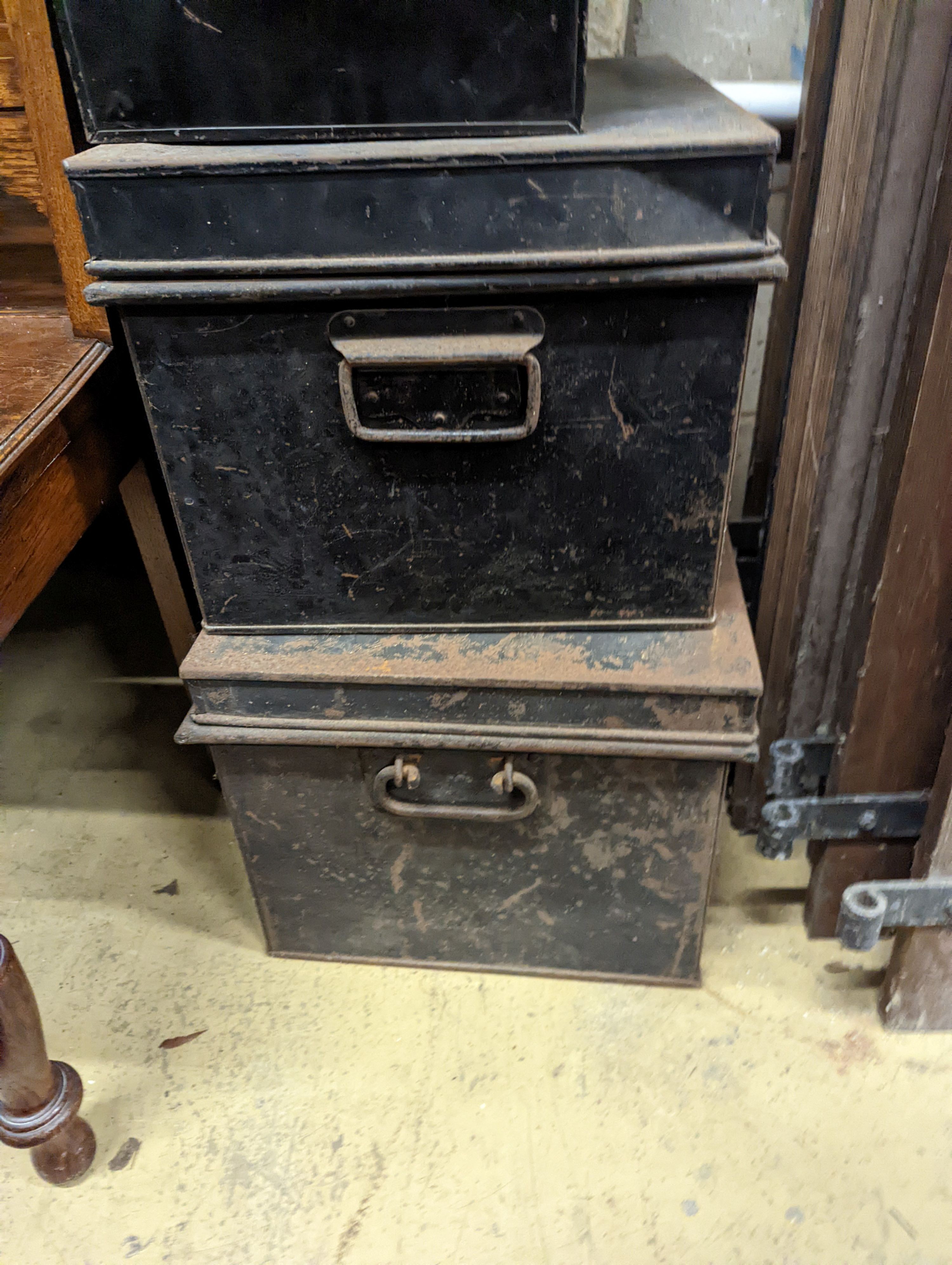 Four rectangular vintage tin trunks, largest width 52cm, depth 36cm